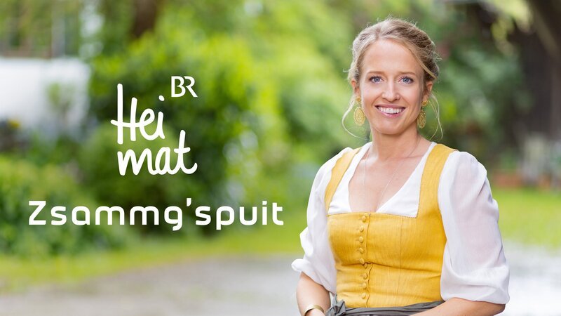 Key Visual/​Cover Sendereihenbild mit Typo zu „BR Heimat – Zsammg’spuit“. Susanne Wiesner (im Bild) erkundet ausgewählte Regionen in Bayern und dem angrenzenden Alpenraum. Sie trifft auf heimische Volksmusikanten und erkundet Geschichte, Brauchtum und Handwerkskunst der jeweiligen Gegend. – Bild: Markus Konvalin /​ BR