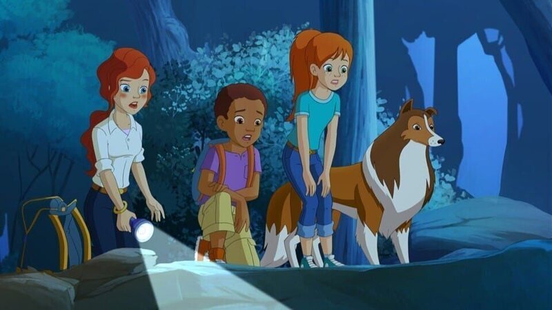 Zoe, ihre Mutter, Harvey und Hündin Lassie beobachten wie das Wolfsrudel direkt auf die Fallen der bösartigen Rancher zulaufen. – Bild: ZDF/​Classic Media/​DC Entertainment/​Superprod