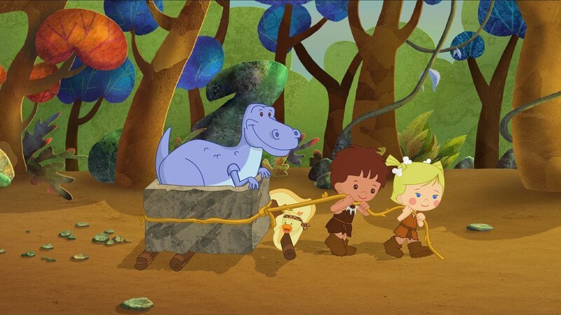 Zoé, Finn und QuackQuack fahren in einem selbst gebauten Wagen und sogar die kleine Babyschwester des Dinos ist dabei. – Bild: KI.KA/​Mike Young Productions