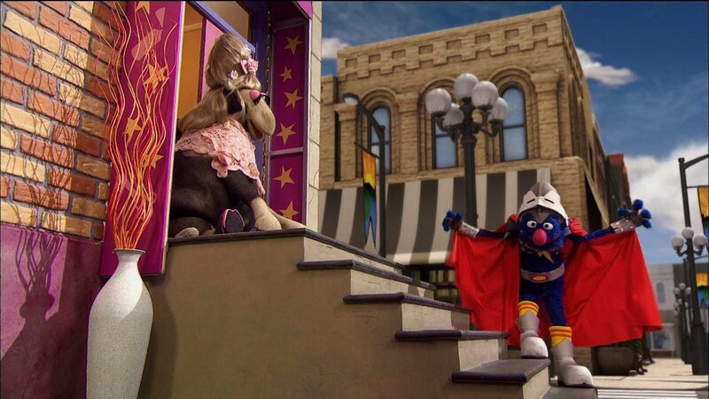 Super Grobi 2.0 (rechts) zeigt der Kuh (links), wie man die Treppe runtergeht. – Bild: NDR /​ Sesame Workshop