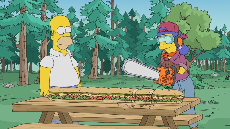 „Die Simpsons“, „Stammesfehde.“ Als Lisa an ihrer Schule eine Szene aus ihrem Familienalltag nachstellt, wird Marge bewusst, wie eintönig ihr Leben doch ist. Da legt ein glücklicher Zufall ein großes Talent der Hausfrau und Mutter frei: Durch einen umgestürzten Baum, den Marge aus dem Weg schafft, kommt ihre Begabung als Holzfällerin zum Vorschein. Bei sportlichen Wettbewerben in dieser Disziplin ist Marge bald unschlagbar. Doch leider scheint sie der Ruhm mehr und mehr von ihrer Familie zu entfremden. – Bild: Fox