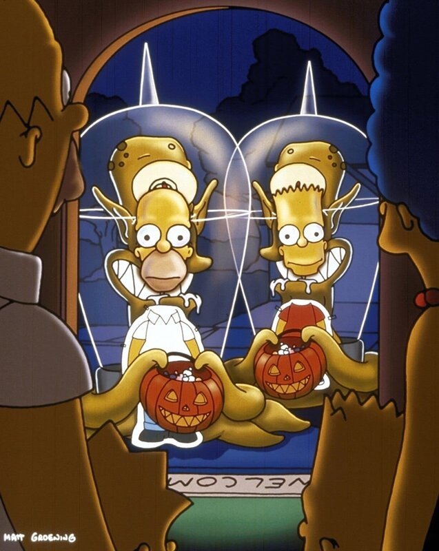 Um sich vor ihren Verfolgern zu verstecken, schlüpfen Homer (l.) und Bart (r.) in eine Fotopappwand. – Bild: ProSieben MAXX