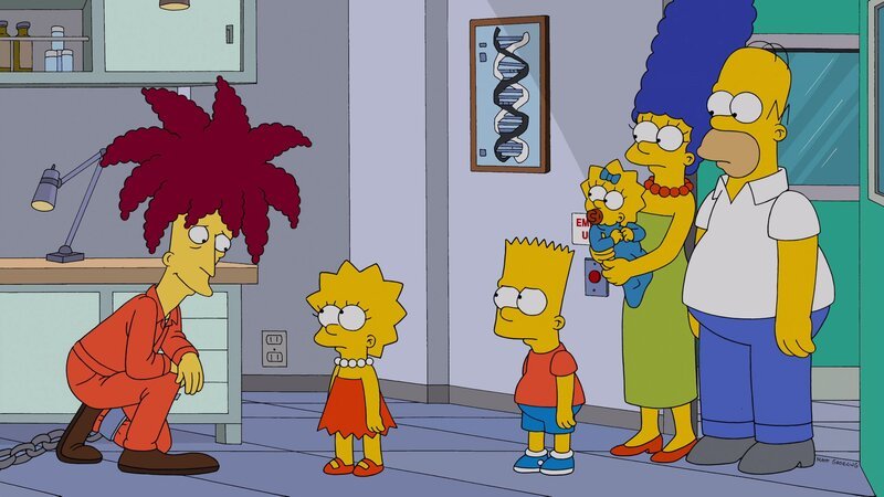 Lisa (2.v.l.) hat durch eigene Forschungen herausgefunden, dass gentechnisch veränderte Lebensmittel gar nicht so schlimm sind, wie alle immer behaupten. Darum darf sie mit Bart (3.v.l.), Homer (r.), Marge (2.v.r.) und Maggie (3.v.r.) das Forschungszentrum der Firma Monsamo besuchen, dessen Chef zu ihrer großen Überraschung Tingeltangel-Bob (l.) ist … – Bild: © 2013 Twentieth Century Fox Film Corporation. All rights reserved.