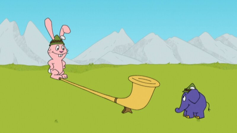 Hase und Elefant spielen ein Alpenhorn. – Bild: WDR