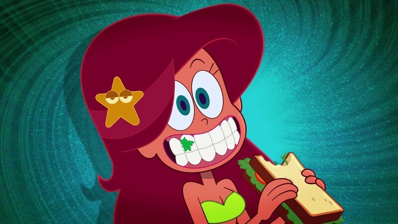 Nachdem Marina ein Sandwich gegessen hat, steckt ein Stück Petersilie zwischen ihren Zähnen.  +++ – Bild: Alles Petersilie?! /​ © Xilam Animation